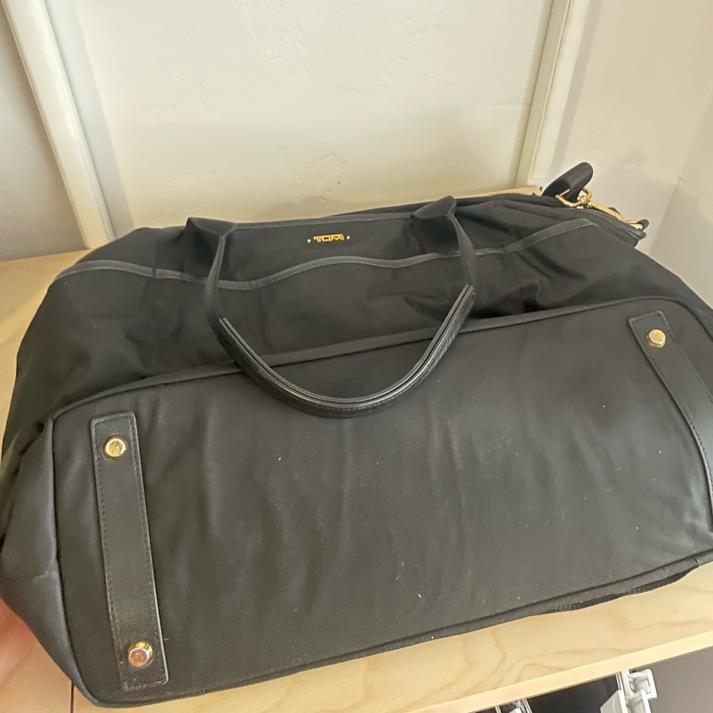 Like new Tumi Voyager travel bag in the color black